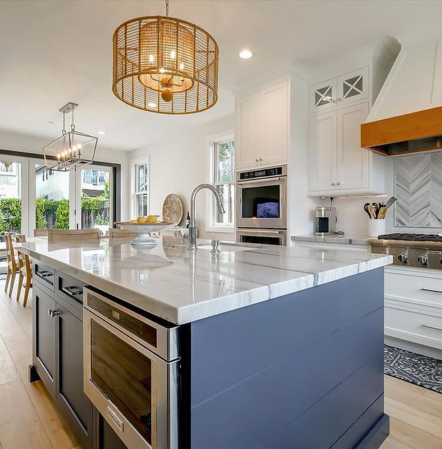 a large kitchen with an island in the middle