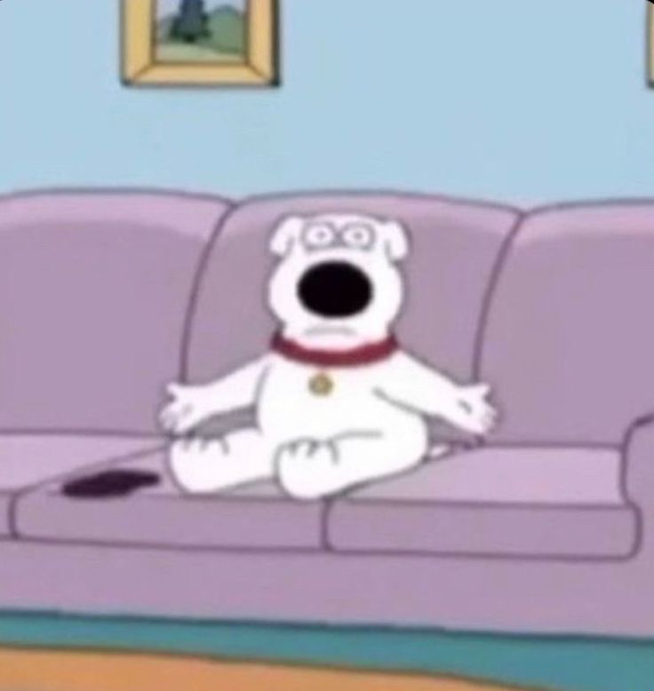 a cartoon dog sitting on top of a couch