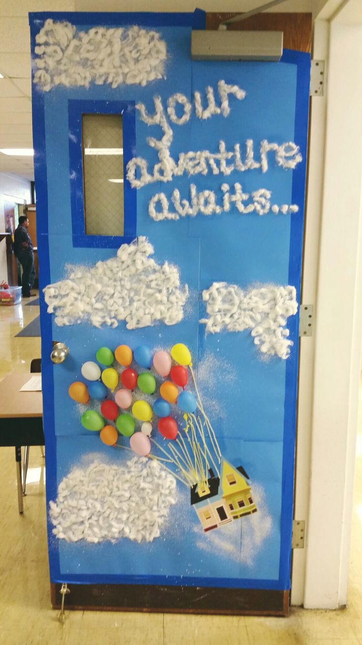 a door decorated with balloons and writing that says your adventure awaits