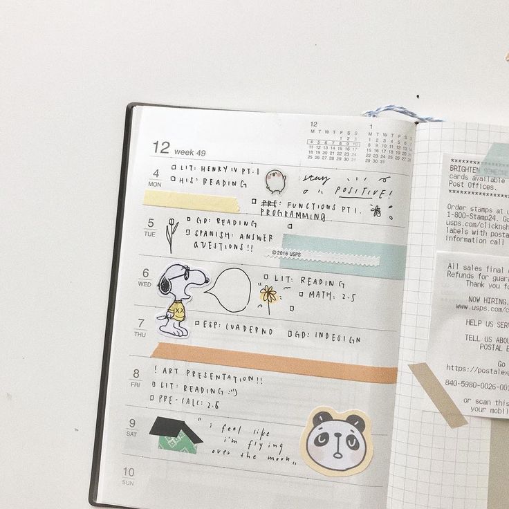 an open notebook with stickers on it