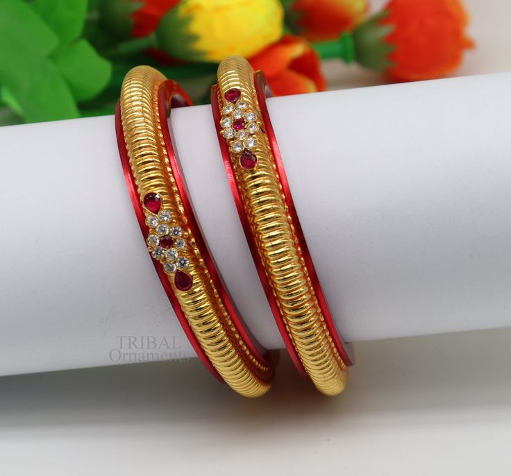 22kt hallmarked gold bangles bracelet Kada made with antique design, we use wax inside for durability of the bangle and use plastic bangle as the base of gold bangle for more durability with using long life. fabulous tribal wedding jewelry from Rajasthan India Metal-22kt yellow gold / Item-Bangles. Stamped-22kt/916 hallmarked. size-select your size. Width of bangle-7 mm approx(with plastic bangle) Net gold weight-10.500 grams approx.(pair bangle) Quantity-Pair The material used- is wax inside an Plastic Bangles With Gold Design, Handmade Gold Plated Bangle For Wedding, Handmade 22k Gold Wedding Bangle, Traditional Gold Bangle For Festival, Traditional 22k Gold Bangle For Festive Occasions, 22k Gold Hallmarked Bangle For Festive Occasions, Handmade Bangle Bracelets, Gold Bangle Set, Plastic Bangles