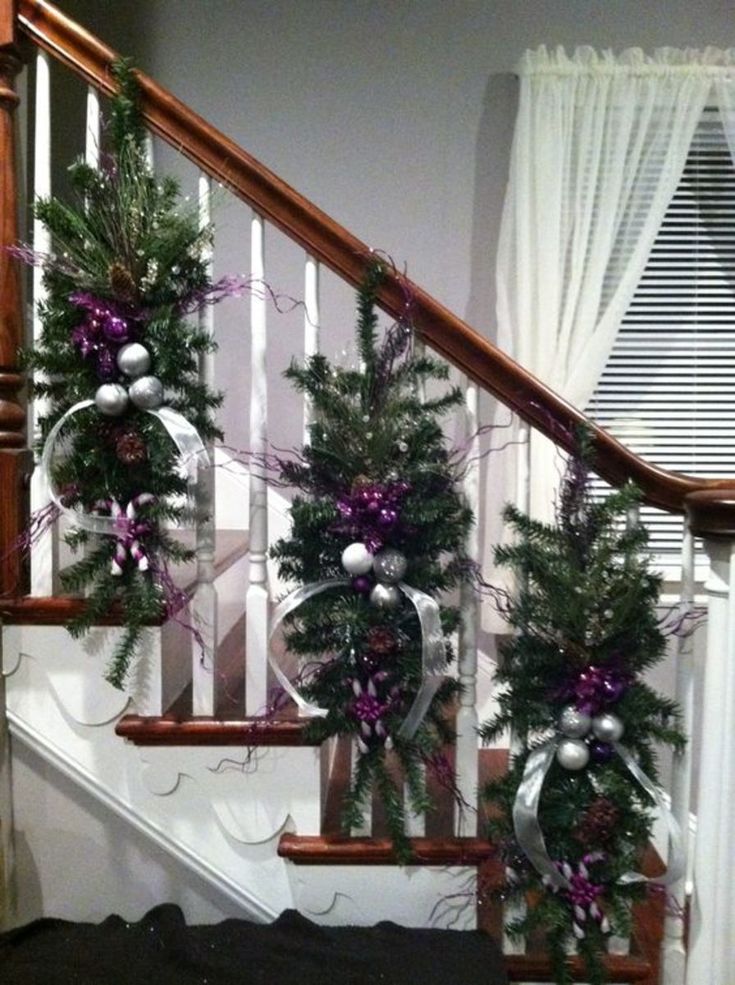 christmas decorations on the banisters and stairs