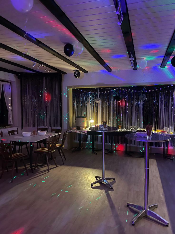 a party room with lights and decorations on the ceiling