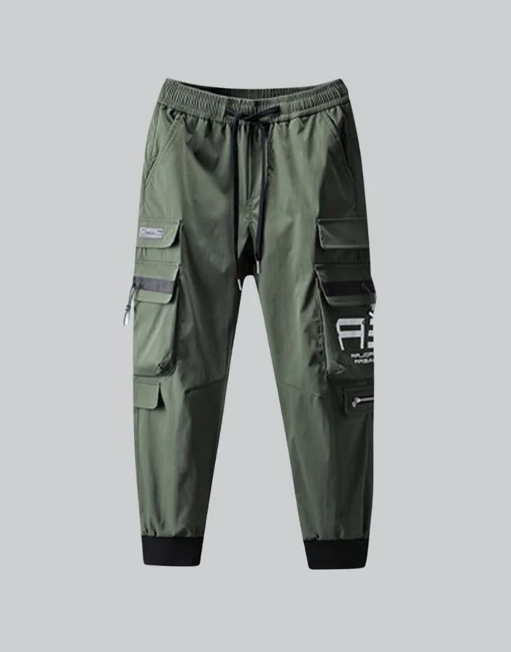 Khaki Cargo Pants Streetwear Techwear Sweatpants With Pockets, Techwear Sweatpants With Side Pockets For Outdoor, Green Cargo Sweatpants For Outdoor, Outdoor Sweatpants With Cargo Pockets, Techwear Sweatpants With Cargo Pockets, Functional Streetwear Pants With Pockets, Functional Baggy Pants For Outdoor Activities, Urban Sweatpants With Cargo Pockets For Outdoor Activities, Urban Pants With Functional Pockets For Streetwear