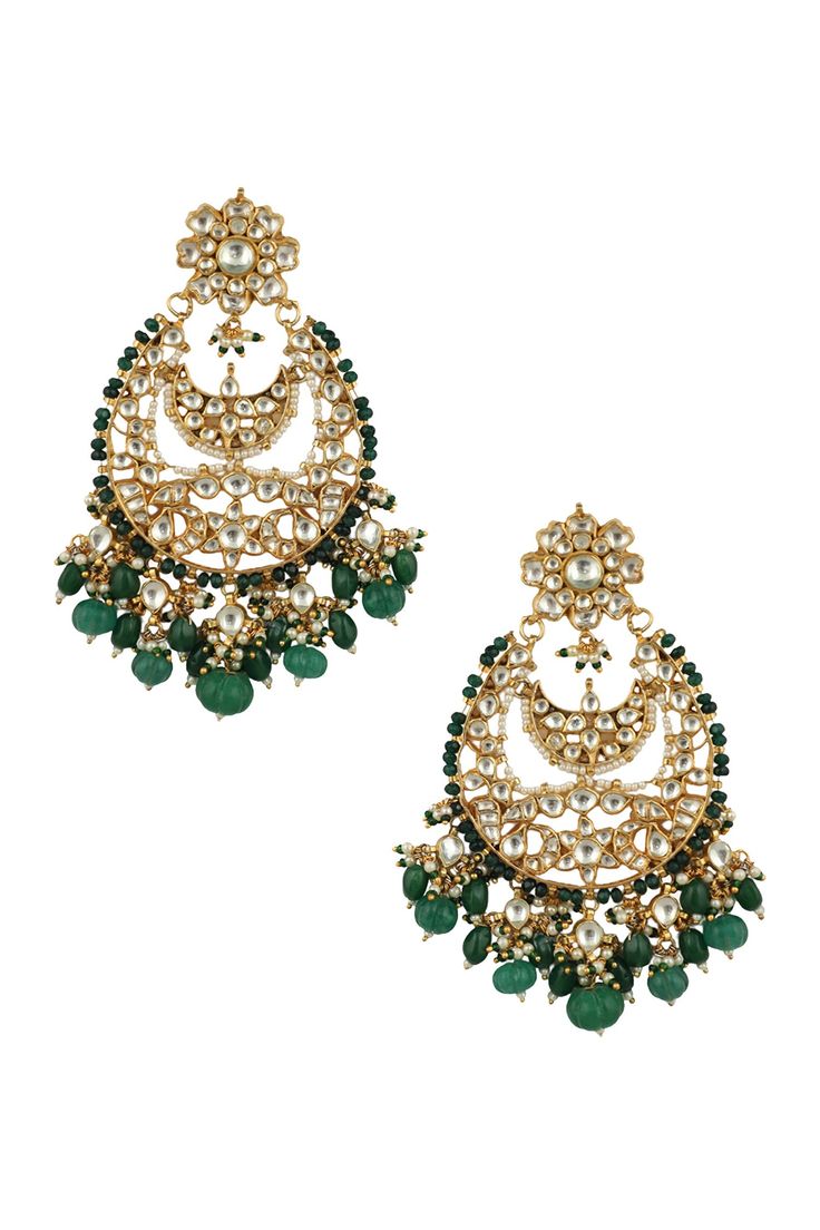 22kt matt gold plated chandbalis with white and green stones.
Type: Real Jadtar Stones, Semi Precious, Pearls, Glass Bleads
Composition: Silver + Copper Mix, 22Kt Gold Plating
Color: White, Green, Gold
Floral top
Crescent moon motif
Size (in cms): L x W: 8 x 6 approx. - Aza Fashions Choker Jewellery, Geometric Stone, Chandbali Earrings, Stone Choker, Gold Jewelry Earrings, Geometric Jewelry, Jewelry Choker, Buy Gold, Online Earrings