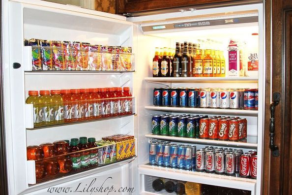 an open refrigerator filled with lots of drinks