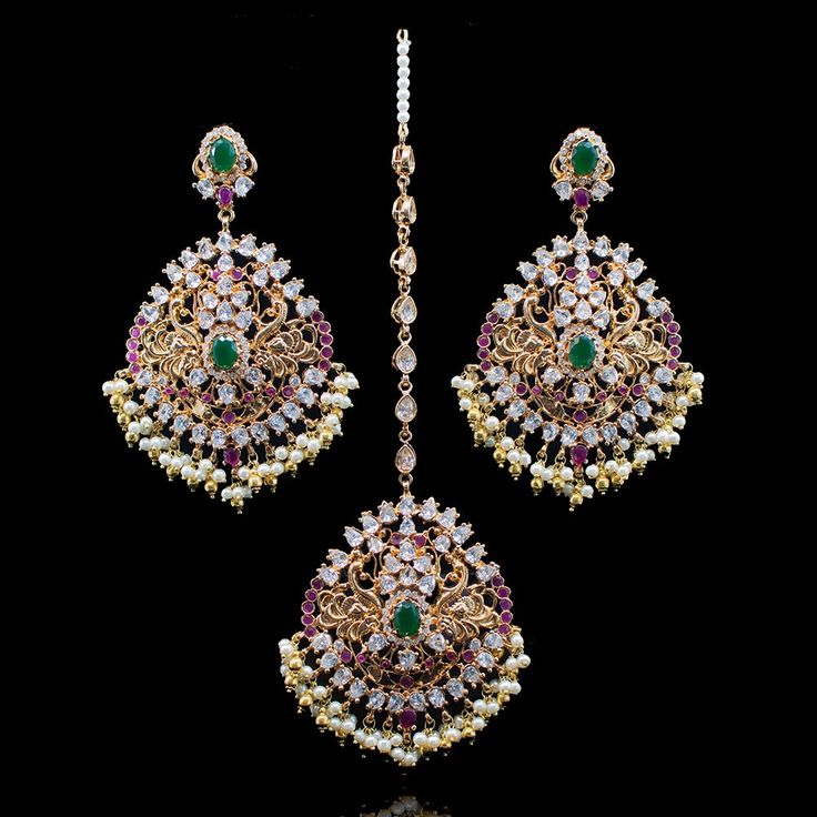 This set comes with a promise of dressing you up in an instant and lends the perfect wedding worthy vibe! The remarkable Ruhya Set is a beautiful and lucid piece featuring glistening ruby and emerald stones together with pearl moti. Approximate earrings length is 4". Gold-plated on high-quality brass as base metal. Made by order. Kindly allow 4-6 weeks for the delivery of this item. For custom or urgent requests, please contact support@alacouture.com. *Please Note: We use faux stones and beads i Heritage Jewellery, Lab Created Emerald, Faux Stone, Waist Chain, Head Accessories, Emerald Stone, The Perfect Wedding, Cz Stone, Base Metal