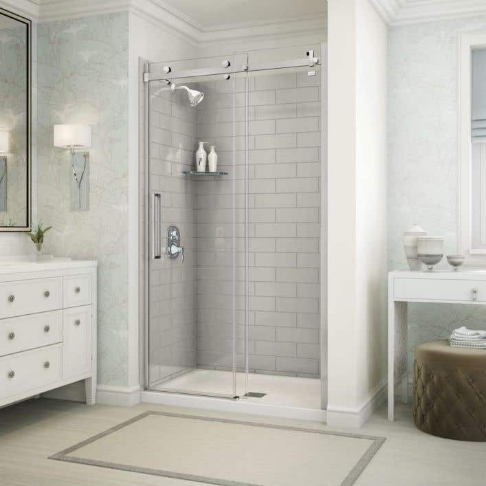 a white bathroom with a walk in shower