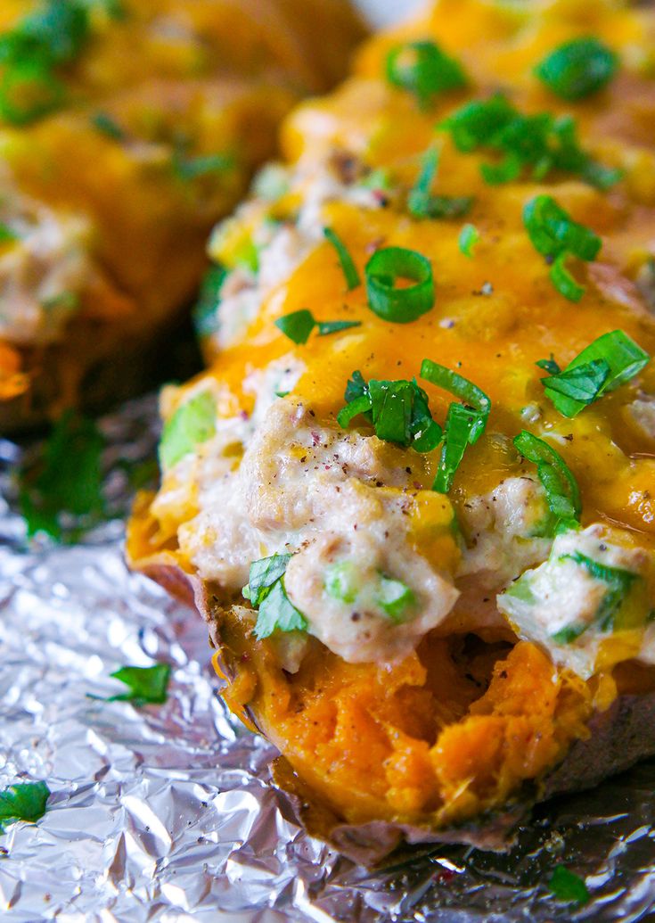 baked potato skins with chicken and cheese on tin foil