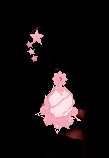 a person holding a cell phone in the dark with pink flowers on it and stars