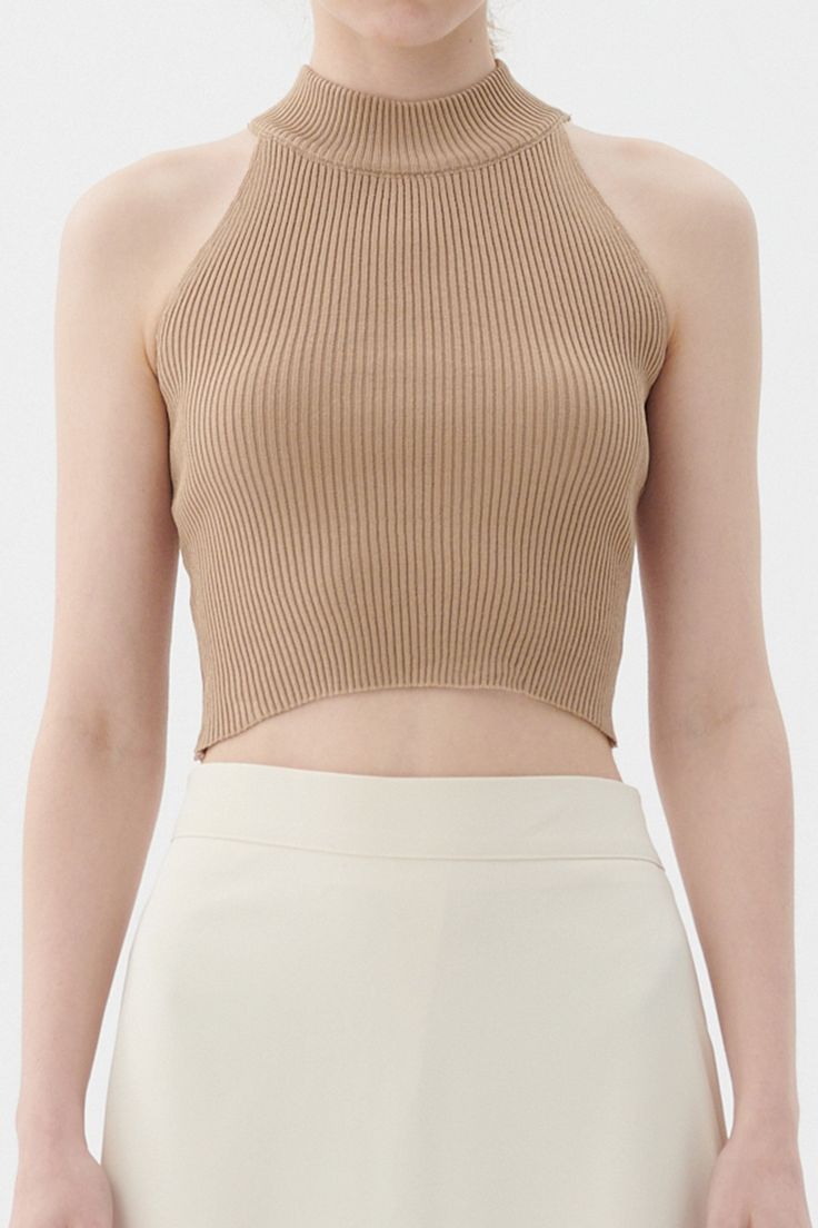 Finley Knitted Crop Top Halter neck style, racer back Cropped length, slim fit Product Specification : 50% Rayon 45% Acrylic 5% Span Professional Clean Only / Do Not Tumble Dry Model's height is 5′ 6″ (170cm) Bust 31.5in Waist 23in Hip 34.5in and wearing S/M Fitted Knit Crop Top In Beige, Textured Knit Fitted Crop Top, Fine Knit Fitted Cropped Crop Top, Beige Knitted Crop Top, Fitted Beige Knit Crop Top, Halter Crop Top, Taupe Color, Lavender Color, Knit Crop