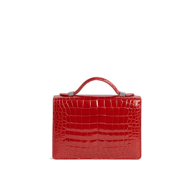 A signature Rubeus jewelled treasure that testifies to the power of classical elegance and Italian artistry. Born as the perfect Christmas present, the Flash Natale dominates all the year around. Small Natale Bag in rouge shining crocodile with palladium closure and adjustable crocodile strap. Interior slip pocket Measurements : 20x15x5.5 cm Made in Italy Elegant Red Formal Bag, Timeless Formal Bag With Crocodile Pattern, Luxury Crocodile Pattern Bags As Gift, Timeless Formal Bags With Crocodile Pattern, Elegant Crocodile Pattern Bag For Gift, Elegant Red Rectangular Case Bag, Luxury Crocodile Pattern Bags For Gifts, Red Evening Bag With Crocodile Pattern, Red Evening Bags With Crocodile Pattern