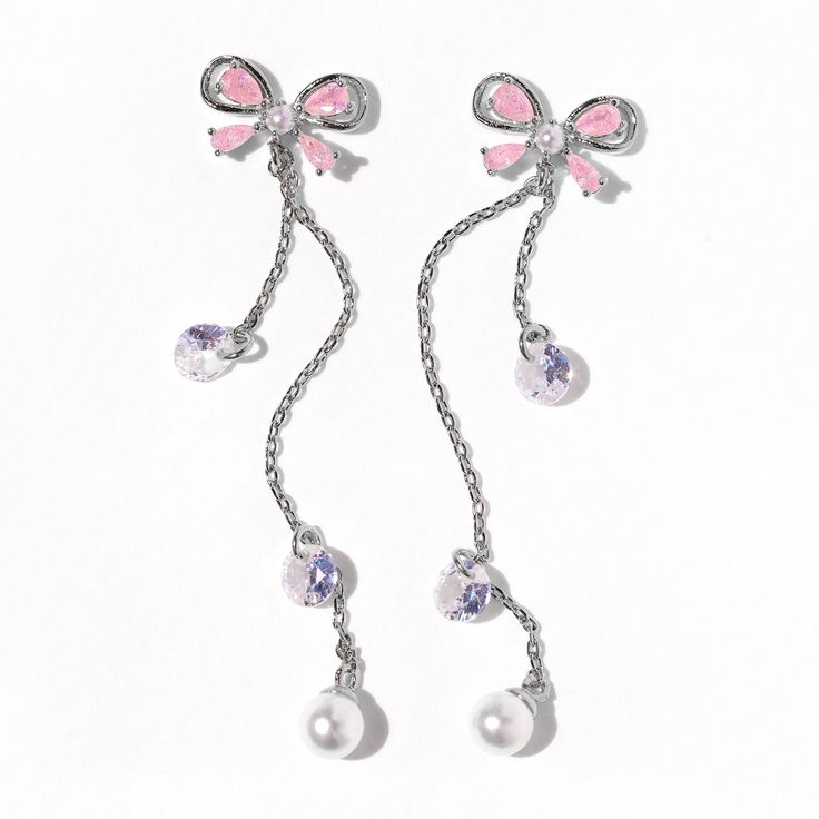 Now this is what dreams are made of. Our Princess Pearl Earrings completely embody Girls Crew’s design aesthetic you have all fallen in love with over the last six years. Are you as obsessed with the ribbon design as we are? We’ve combined baby pink CZ stones in the shape of delicate bows, pearls, and delicate “droplets.” Elegant White Jewelry With Pink Bow, Party Jewelry With Pink Bow In White, White Jewelry With Pink Bow For Party, White Party Jewelry With Pink Bow, Pink Dangle Crystal Earrings For Gift, Pink Ribbon Wedding Jewelry, Pink Bow Jewelry For Anniversary, Pink Ribbon Jewelry As Gift, Pink Ribbon Jewelry Gift