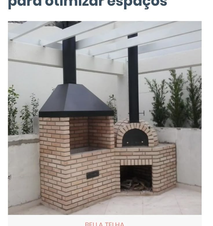 an outdoor brick pizza oven in the middle of a patio with white walls and pergolated roof