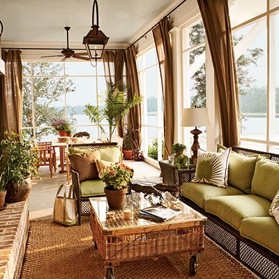 a living room filled with lots of furniture next to a fire place covered in plants