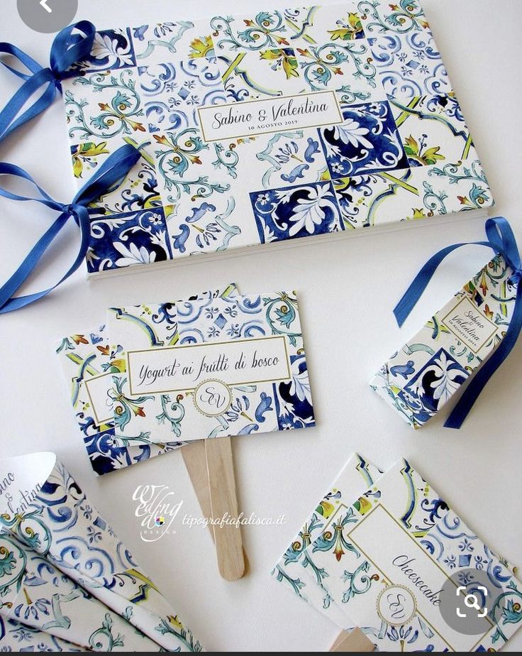 an assortment of blue and white wedding favors