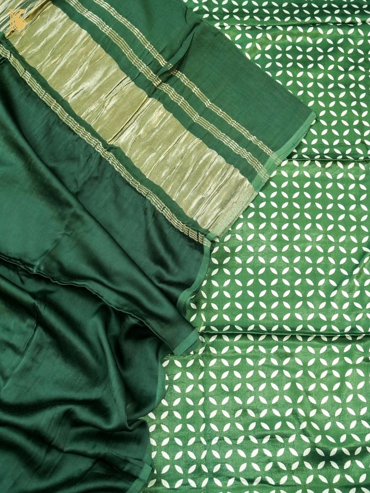 Category - Pure Mashru Silk Fabric Khinkhwab brings you an exclusive Mashru Silk range that is sure to make you fall in love with. Fabric - Pure Mashru Silk Mashru silk has a silk warp and a cotton weft and warp-faced fabric, or sateen which means that the face of the cloth is predominantly silk and the reverse is cotton. It is a lightweight fabric and as soft as butter. Craftsmanship - Ajrakh Note- There may be slight color variations due to photographic reasons. This is a hand-woven product and any irregularities in the weaving or pattern should not be taken as a defect. These irregularities make every handloom piece unique Suit Fabric, The Cloth, Silk Fabric, Lightweight Fabric, Silk Sarees, Hand Woven, Color Variations, All Products, Hand Weaving