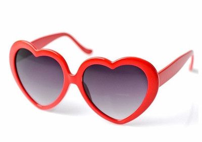 These heart shaped sunglasses are a super cute accessory for any gal! Trendy Heart-shaped Sunglasses With Heart Print, Trendy Heart-shaped Tinted Sunglasses, Trendy Heart Shaped Tinted Sunglasses, Cute Heart Print Sunglasses For Valentine's Day, Heart Print Sunglasses For Valentine's Day Beach Outing, Trendy Heart Print Sunglasses For Valentine's Day, Trendy Valentine's Day Sunglasses With Heart Print, Heart-shaped Sunglasses For Valentine's Day, Trendy Heart-shaped Sunglasses For Valentine's Day