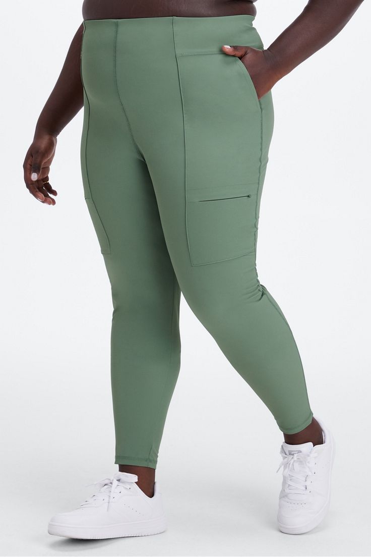 Hybrid Cargo Pant Fabletics green female plus Slim-fit cargo style with multiple pockets Stretch Green Joggers With Side Pockets, Green Activewear With Side Pockets For Yoga, Green Relaxed Fit Cargo Pants For Sports, Green Athleisure Cargo Pants For Sports, Green Relaxed Fit Cargo Pants For Casual Use, Green Activewear With Side Pockets For Gym, Green Activewear With Side Pockets For Sports, Green Stretch Sporty Cargo Pants, Versatile Green Cargo Pants