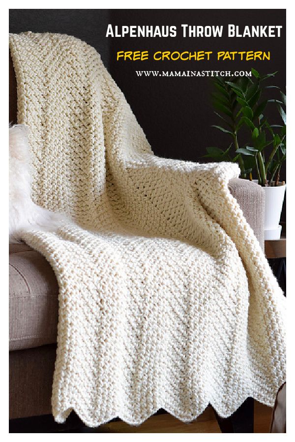 a white crocheted blanket sitting on top of a couch next to a potted plant