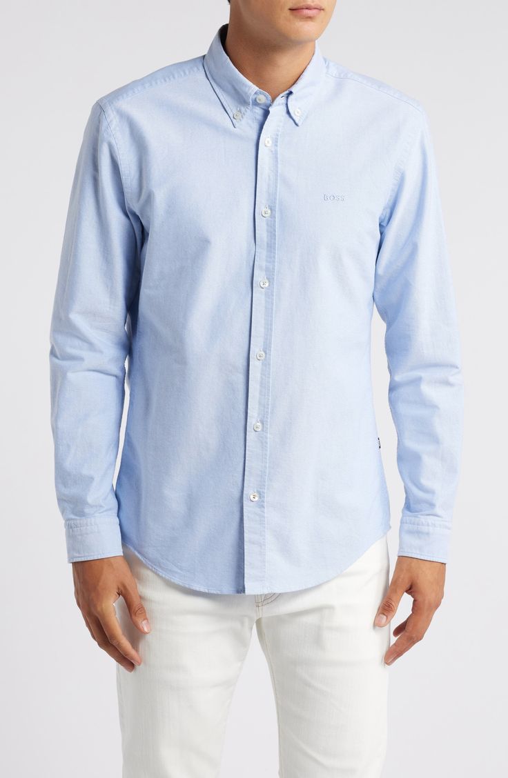 Comfortable and versatile, this solid-color shirt tailored from soft cotton looks great whether you wear it tucked or untucked. 29" length; 40" chest (size Medium) Front button closure Button-down collar Long sleeves with button cuffs 100% cotton Dry clean or machine wash, dry flat Imported Cotton Shirt With Button Cuffs, Casual Cotton Button-up Dress Shirt, Relaxed Fit Cotton Dress Shirt, Long Sleeve Cotton Dress Shirt With Buttons, Cotton Workwear Shirt, Slim Fit Cotton Shirt With Button Cuffs, Long Sleeve Cotton Shirt With Button Closure, Casual Cotton Dress Shirt With Spread Collar, Classic Cotton Shirt For Daywear