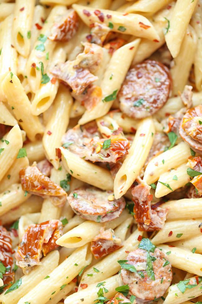 pasta with sausage and tomato sauce in a bowl