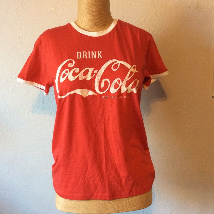 Coca Cola T-Shirt Red With White Graphics And Trim. Nwot. Great Condition. Size Small (Juniors). Measurements Laying Flat May Vary Slightly. Photos Don’t Always Reflect True Colors. Let Me Know If You Have Any Questions. Retro Red T-shirt With Screen Print, Red Retro Top With Graphic Print, Retro Red Top With Letter Print, Red Short Sleeve T-shirt With Text Print, Retro Red T-shirt With Logo Print, Red Summer Tops With Screen Print, Red Screen Print Tops For Summer, Red Short Sleeve Shirt With Text Print, Retro Red Pre-shrunk T-shirt