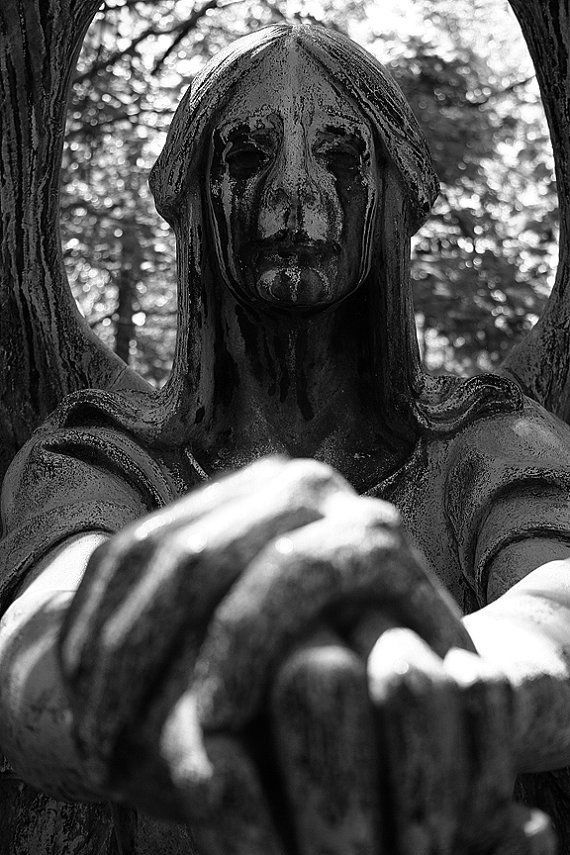 a statue is shown in front of some trees