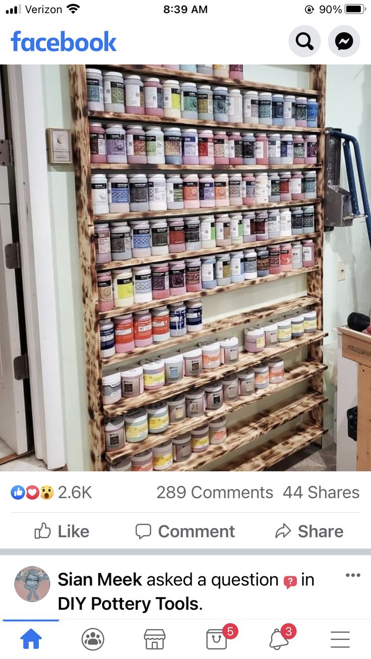 a facebook post with an image of a shelf full of paint cans and other items