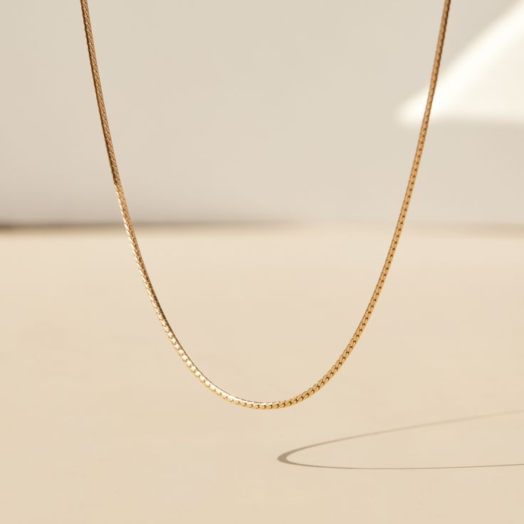 Laps of gold � the most fluid, aqueous chain of them all. A slinky, shining length of gold to wear on its own, or in a stack. You can indeed wear your Swimming Pool piece in a swimming pool � that is the benefit of solid 14k gold. Put it on, never take it off. Made with 100% recycled 14k solid gold chain. When not wearing your Swimming Pool piece, we suggest storing it flat, in its natural shape, which best suits herringbone chains. Gold Box Chain Necklace For Everyday Luxury, Delicate Gold Snake Chain Necklace For Formal Occasions, Formal Gold Snake Chain Necklace With Delicate Chain, Luxury Gold Snake Chain Necklace, Catbird Jewelry, Solid Gold Chains, Yellow Gold Chain, Recycled Gold, Gifts For Wedding Party