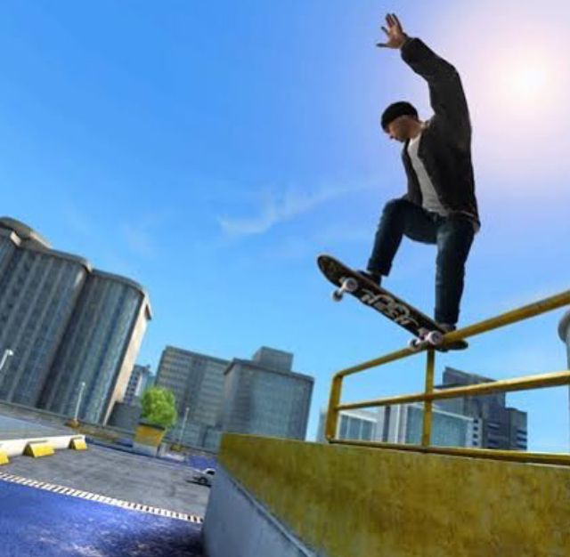 a man riding a skateboard up the side of a rail on top of a ramp