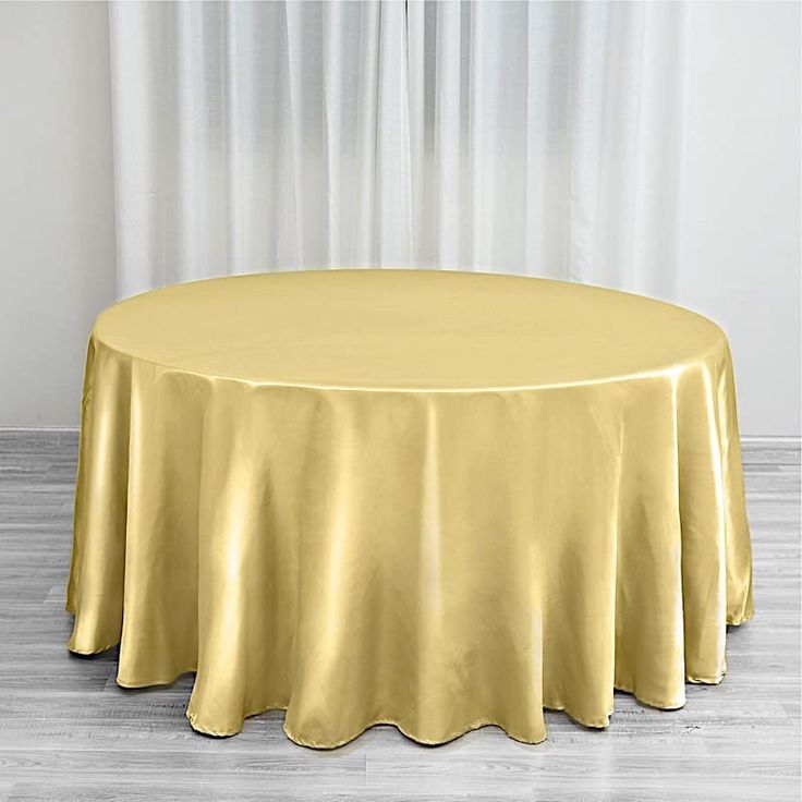 PRICES MAY VARY. IMPRESS YOUR GUESTS – Our satin round tablecloths will help you to create a sophisticated and unique look for your event. Our satin fabric is one of the highest quality you can find. EASY CARE & REUSABLE – Satin table cloth can be dry clean only. Satin table linens are affordable and can be reused many times with proper care. HIGH-QUALITY – Round table cloth made from high-quality satin fabric, stain and wrinkle resistant. Thickness: 135 gsm (grams per square meter). Available i Table Overlays, Photography Decor, Party Table Cloth, Chair Sashes, Elegant Table Settings, Mantel Redondo, Table Skirt, Color Champagne, Gold Table