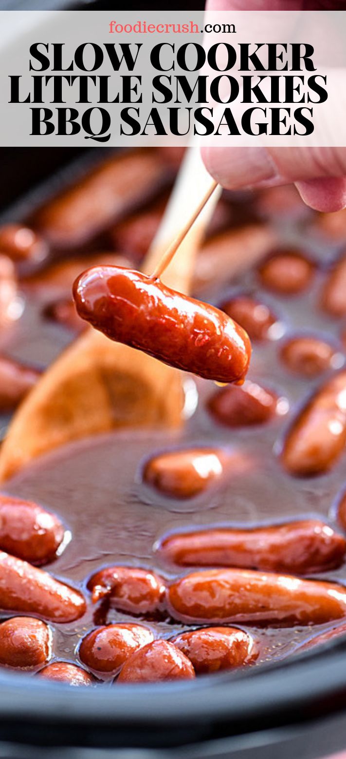 a person dipping hotdogs into a slow cooker full of bbq sausages