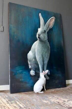 a painting of a bunny and a rabbit sitting next to each other on a wooden floor