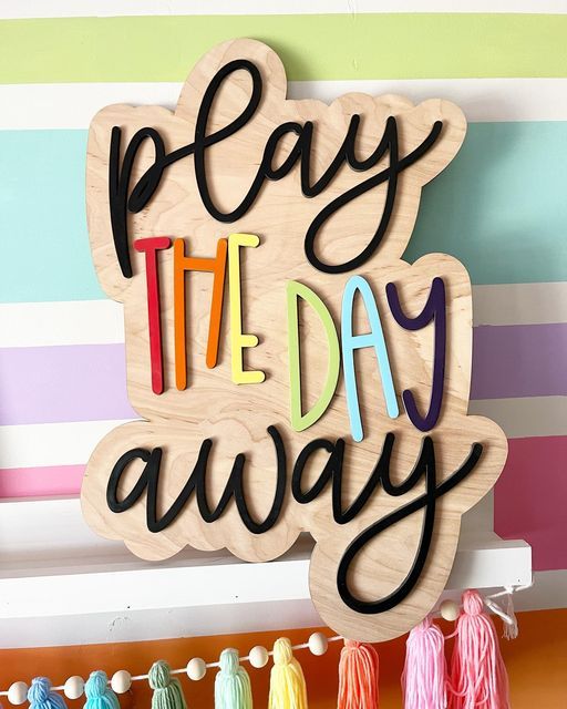 Mama Roe Designs Nursery Decor on Instagram: "Let’s Play the Day Away!" Playroom Wood Signs, Playroom Signs Diy, Playroom Sign Ideas, Playroom Neon Sign, Playroom Signs Wall Decor, Playroom Paint Ideas, Colorful Playroom Ideas, Nursery Wood Signs, Playroom Paint Colors