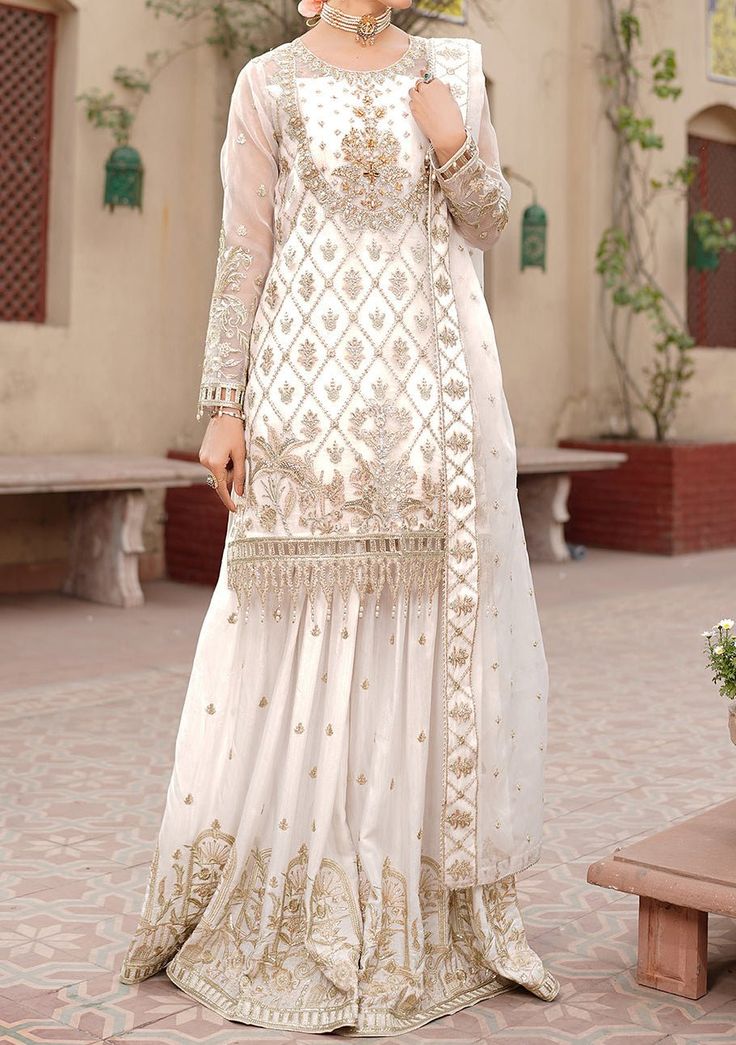 Elegant Off-white Festive Sets, Elegant Cream Colored Festive Set, Designer Off White Dresses With Intricate Embroidery, Off White Designer Dress With Intricate Embroidery, Fitted Beige Georgette Set, Elegant Designer Beige Sets, Elegant Off White Gown With Resham Embroidery, Elegant Off White Georgette Sharara, Elegant Off-white Georgette Sharara