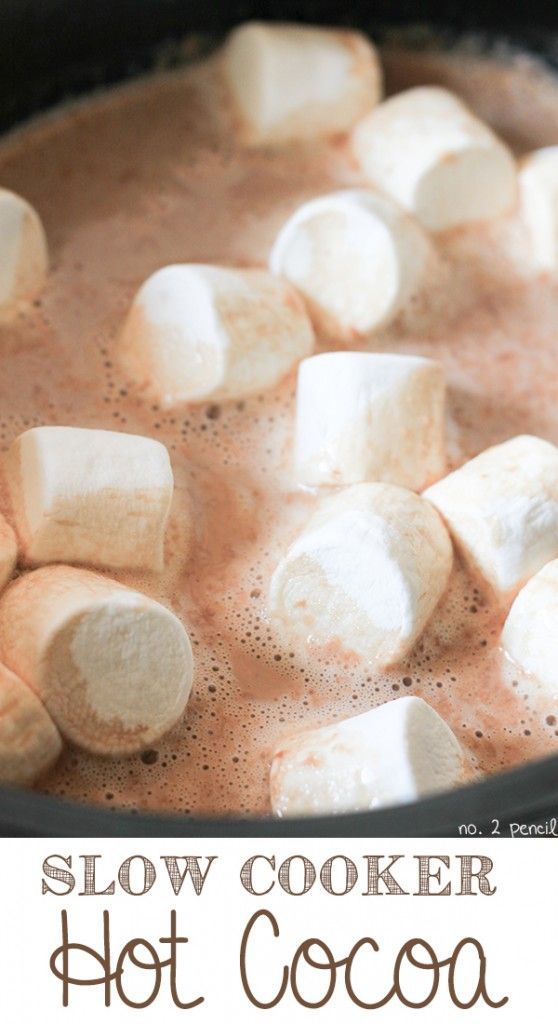 marshmallows are being cooked in a pot of hot chocolate