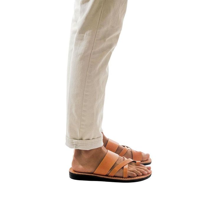 Model wearing The Good Shepherd tan, handmade leather slide sandals with toe loop Mens Slide Sandals, Ankle Strap Sandals Flat, Toe Ring Sandals, Toe Loop Sandals, Adjustable Sandals, Good Shepherd, Leather Gladiator Sandals, Closed Toe Sandals, Ankle Strap Flats