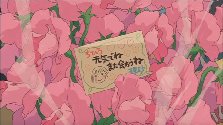 there is a sign in the middle of pink flowers with writing on it that says,