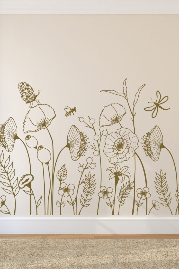 a wall decal with flowers and butterflies in the middle, on a beige background