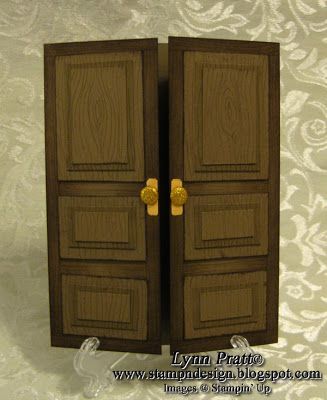 two wooden doors with gold handles on a white wallpapered background, one opened and the other closed