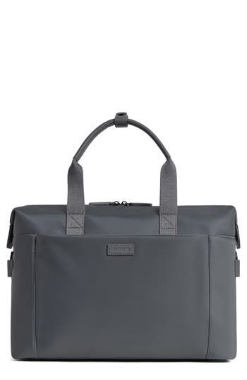 Carrying workout essentials is easy in this spacious duffle bag that comes with a removable zip pouch and a handy crossbody strap. Made from materials that are both water and scratch resistant, it promises lasting wear and style throughout the seasons. Lined Nylon/polyurethane/cotton/reycled polyester Spot clean Imported Functional Duffle Bag With Removable Pouch Tote, Modern Nylon Rectangular Gym Bag, Functional Travel Bag With Removable Pouch, Functional Travel Bag With Removable Pouch And Double Handle, Modern Large Capacity Gym Bag, Functional Nylon Shoulder Weekender Bag, Modern Nylon Duffle Bag With Removable Pouch, Functional Nylon Bag With Top Handle, Modern Nylon Duffle Bag With Luggage Sleeve