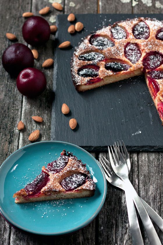 a piece of pie sitting on top of a blue plate next to a knife and fork