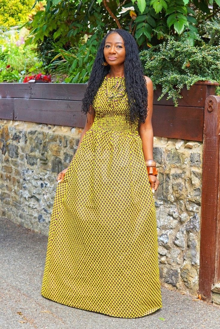 "AMEENA dress - Long. An exquisite understated African print maxi dress in a subtle contemporary pattern print in mustard with dashes of orange and navy blue, hues. It has a ruching detail at the chest and a skater inspired back with tie at the nape. The smocking at the back and waist with the flow of the skirt gives a flattering fit and flare silhouette. Dress up or down to suit the occasion. Handmade in Ghana. 100% cotton. Length appx 57/58\"	in stock	98.55 USD	"	25.81 USD	Clothing > Women's C African Print Maxi Dress, Fuschia Dress, Silhouette Dress, Contemporary Pattern, Printed Maxi, Royal Fashion, Printed Maxi Dress, Dress Clothes For Women, Blue Hues