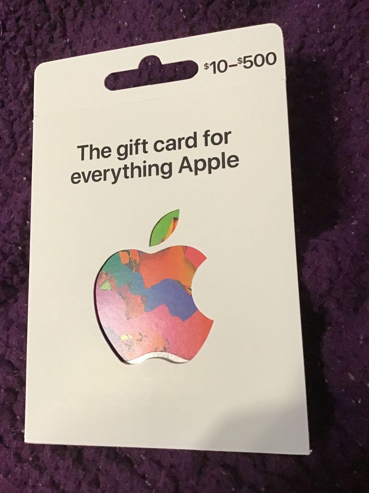 the gift card for everything apple has been placed on a purple carpeted surface,