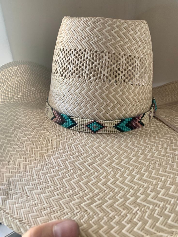 "5/8\" wide All bead work is beaded with 10lb extreme braided nylon line. All hat bands are finished at 23\" with glued than sewed down leather ends and an adjustable leather tie." Adjustable Braided Hat For Rodeo, Adjustable Braided Western Hat, Western Style Adjustable Braided Hat, Western Style Woven Brown Hat Band, Brown Woven Western Hat Band, Adjustable Hat Band With Bead Caps For Festival, Adjustable Bead Cap Hat Bands For Festival, Adjustable Hat Bands With Flat Crown For Rodeo, Adjustable Woven Hat With Flat Crown