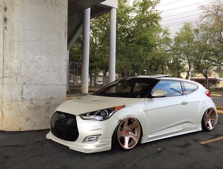 a white car parked in a parking lot