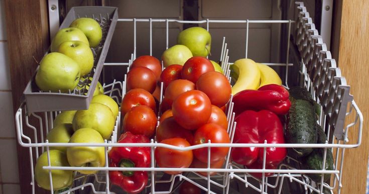 there are many different types of fruits and vegetables in the dishwasher