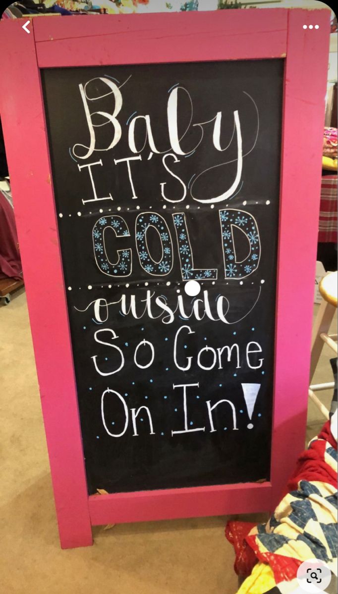 a chalkboard sign that says baby it's cold outside so come on in