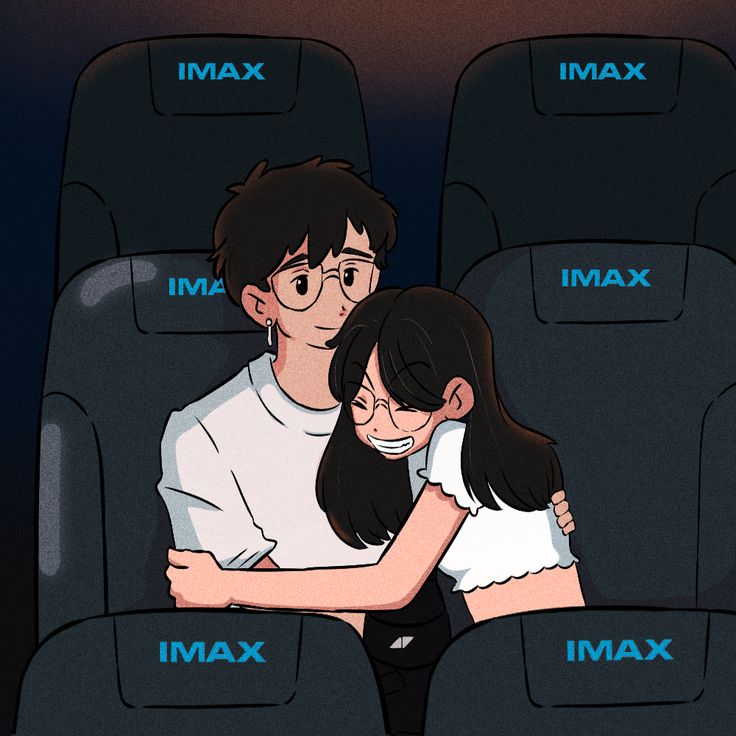 a man and woman are sitting in an airplane with their arms wrapped around each other